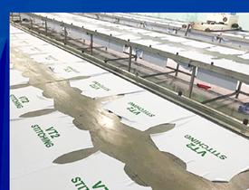 Thành phẩm in logo thương hiệu trên vải đồng phục